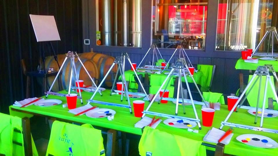 Easels, canvases, and painting supplies ready for a group class